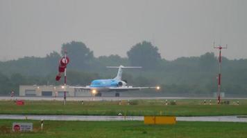 DUSSELDORF, GERMANY JULY 24, 2017 - KLM Cityhopper Fokker 70 PH KZI taxiing after landing at rainy weather. Dusseldorf airport, Germany video