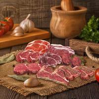 raw meat steak, barbecue sprinkle herbs, spice, freshness vegetable isolated on white background photo