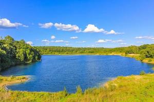 Beautiful quarry lake dredging pond lake blue turquoise water Germany. photo