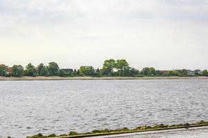 Wadden sea tidelands coast beach water landscape Harrier Sand Germany. photo