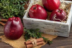 Red apples on a dark, wooden background. Selective focus. Harvesting. Healthy food. photo