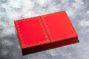 Gift vintage cards in a red box. Selective focus. photo