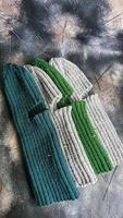 Handmade balaclava with Ukrainian symbols. Knitted from gray and green threads. Warms, reliably saves from the cold. photo