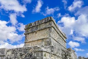 Ancient Tulum ruins Mayan site temple pyramids artifacts seascape Mexico. photo