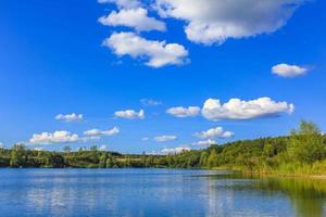 Beautiful quarry lake dredging pond lake blue turquoise water Germany. photo