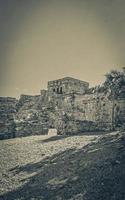 Ancient Tulum ruins Mayan site temple pyramids artifacts seascape Mexico. photo