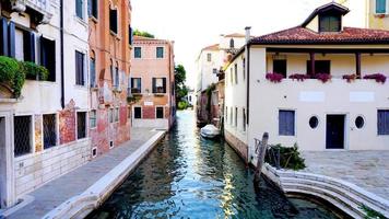 Alley with ancient architecture and canal photo