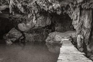 Amazing blue turquoise water and limestone cave sinkhole cenote Mexico. photo