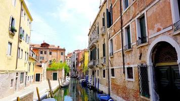 View of canal and boats with ancient architecture photo
