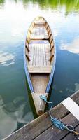 Wood boat in the lake photo