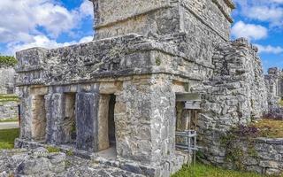 Ancient Tulum ruins Mayan site temple pyramids artifacts seascape Mexico. photo