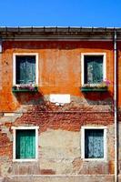 2 doors and 2 windows ancient building italy photo