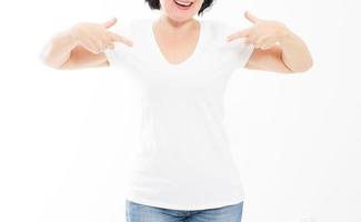 Woman In White T-shirt Pointing To Herself. Point tshirt mock up copy space - cropped image. photo