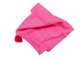 Pink folded napkin top view isolated on white background photo