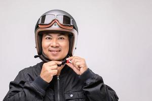 Motorcyclist or rider wearing vintage helmet. Safe ride concept. Studio shot on isolated on grey