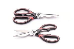 New scissor with red and black color on handle isolated on white photo