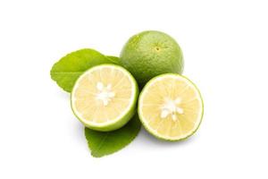 Slice of Thai Lime Common Lime or local lime isolated on white background. Food and healthcare concept photo
