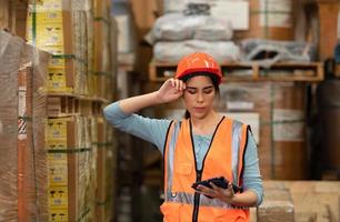 Portrait of an Asian female engineer with the personality of working in the warehouse photo