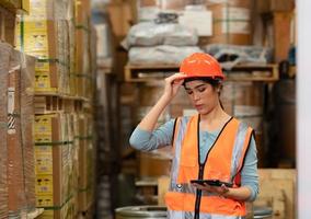 Portrait of an Asian female engineer with the personality of working in the warehouse photo