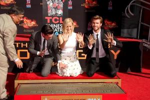 LOS ANGELES, OCT 31 -  Josh Hutcherson, Jennifer Lawrence, Liam Hemsworth at the Hunger Games Handprint and Footprint Ceremony at the TCL Chinese Theater on October 31, 2015 in Los Angeles, CA photo