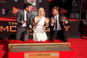 LOS ANGELES, OCT 31 -  Josh Hutcherson, Jennifer Lawrence, Liam Hemsworth at the Hunger Games Handprint and Footprint Ceremony at the TCL Chinese Theater on October 31, 2015 in Los Angeles, CA photo