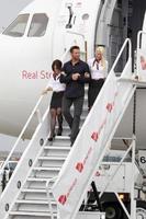 LOS ANGELES, SEPT 23 -  Hugh Jackman with Virgin America flight attendents arrives as Virgin America unveils new DreamWorks  Reel Steel  plane at LAX Airport on September 23, 2011 in Los Angeles, CA photo
