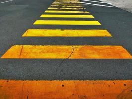 Zebra lines on road as symbol for cross walk way photo