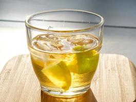 Golden rum on the rocks photo