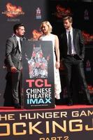 LOS ANGELES, OCT 31 -  Josh Hutcherson, Jennifer Lawrence, Liam Hemsworth at the Hunger Games Handprint and Footprint Ceremony at the TCL Chinese Theater on October 31, 2015 in Los Angeles, CA photo