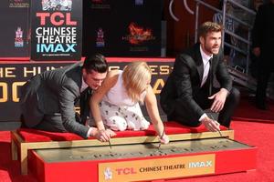LOS ANGELES, OCT 31 -  Josh Hutcherson, Jennifer Lawrence, Liam Hemsworth at the Hunger Games Handprint and Footprint Ceremony at the TCL Chinese Theater on October 31, 2015 in Los Angeles, CA photo
