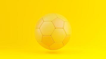 Yellow soccer ball on the yellow background. photo