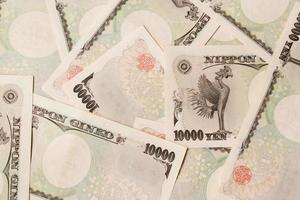 Grupo de billetes de banco japoneses 10000 yenes antecedentes foto