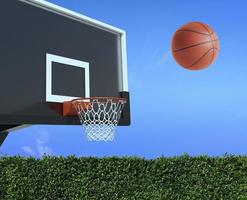 A player throws a basketball towards the net and trying to get a score photo