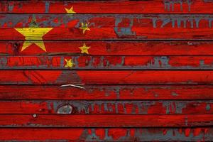 The national flag of China  is painted on uneven boards. Country symbol. photo