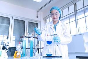 Asian woman scientist, researcher, technician, or student conducted research in laboratory