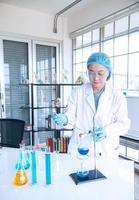 Asian woman scientist, researcher, technician, or student conducted research in laboratory photo