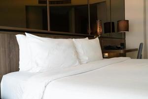 white pillows on bed decoration in bedroom photo