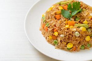 fried rice with green peas, carrot and corn photo