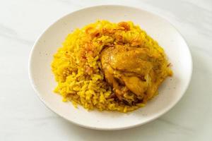 Chicken Biryani or Curried rice and chicken - Thai-Muslim version of Indian biryani, with fragrant yellow rice and chicken photo