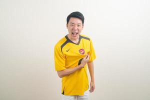 Bangkok, THAILAND - Nov 27, 2021 - Young Asian man wearing Arsenal shirt with white background. photo