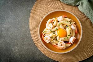 penne pasta white cream sauce with shrimps and egg photo