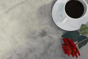 Coffee with red rose on marble desk. Top view. Flat lay. Copy space. photo