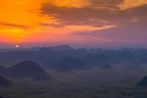 Yellow rapeseed flower field in Luoping, China photo