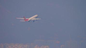 HONG KONG NOVEMBER 10, 2019 - Hong Kong Airlines Airbus A330 airliner climbing up in the air right after take off from Chek Lap Kok international airport, Hong Kong. video