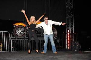 LOS ANGELES, OCT 21 - Gretchen Rossi, Artist Jack Armstrong and the Cosmic Starship Harley at the Harley Davidson Showcase - Unveiling of Cosmic Harley by Artist Jack Armstrong on October 21, 2010 photo