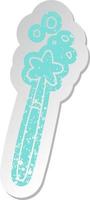 distressed old sticker of a magic wand vector