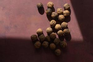 Walnuts on rustic background photo