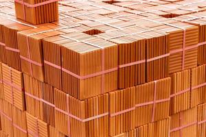Stack of brown tiles at the constructing site photo