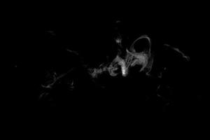 Abstract powder or smoke effect isolated on black background photo