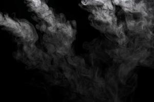 Abstract powder or smoke effect isolated on black background photo